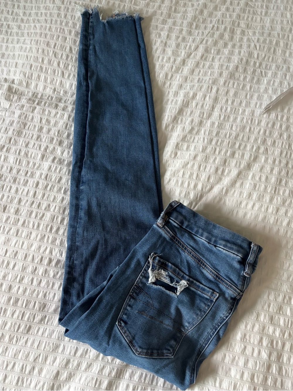 Distressed Slim fit Jeans with Raw edge Hem